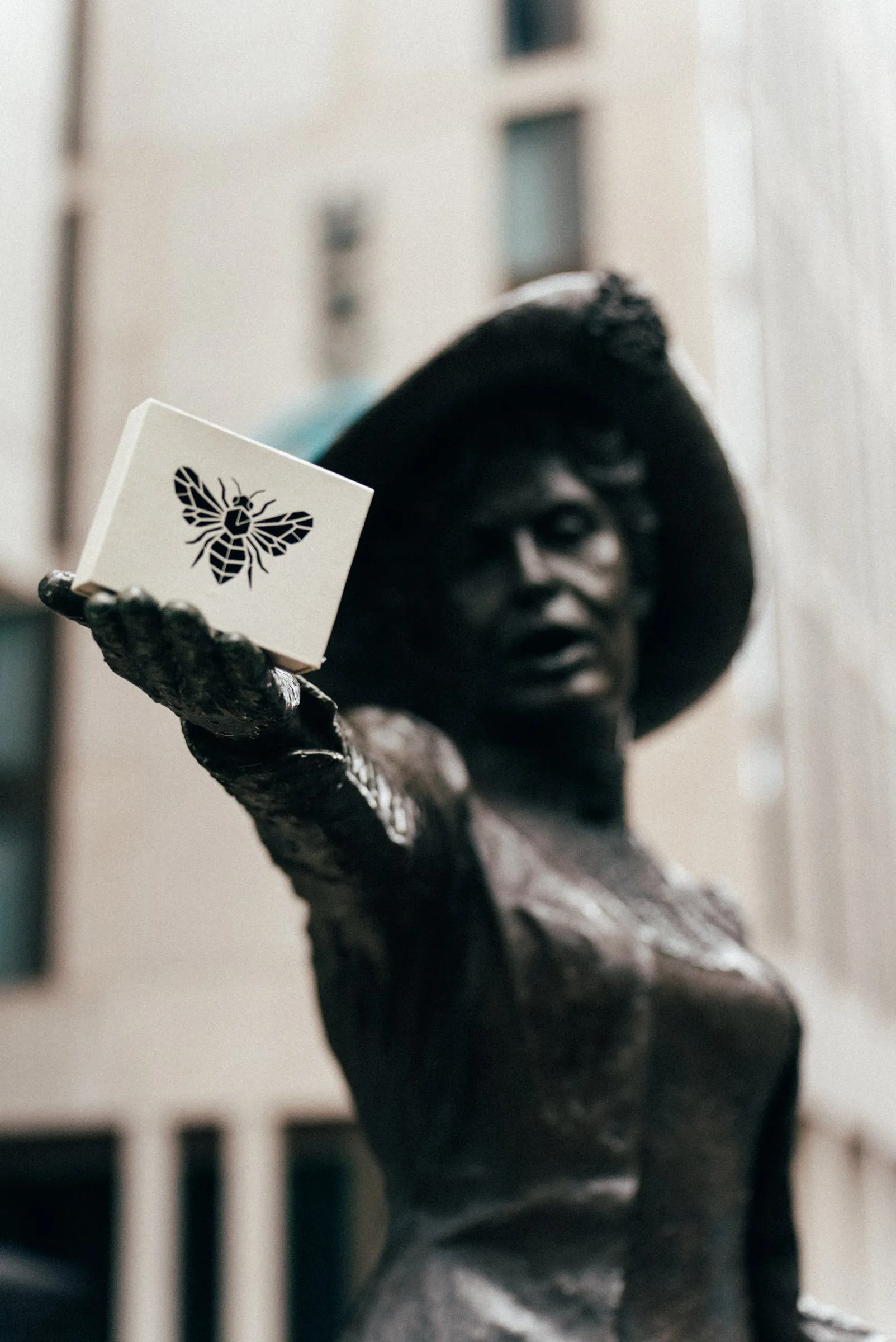 The Emmeline Pankhurst statue in St Peter's Square holding the Archive discovery set.